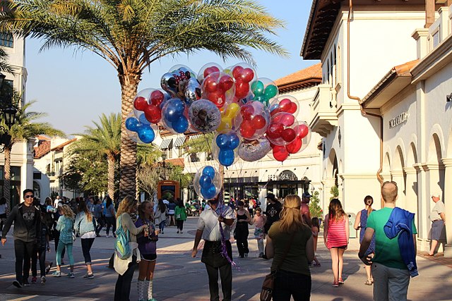 Red, green, blue, and yellow glasshouse Mickey Disney World Balloons for sale at Disney Springs.