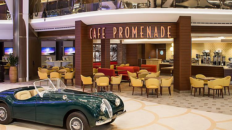 Get food at midnight at Café Promenade instead of a midnight buffet on Royal Caribbean Cruise Ships. Café with yellow chairs and a blue vintage car.