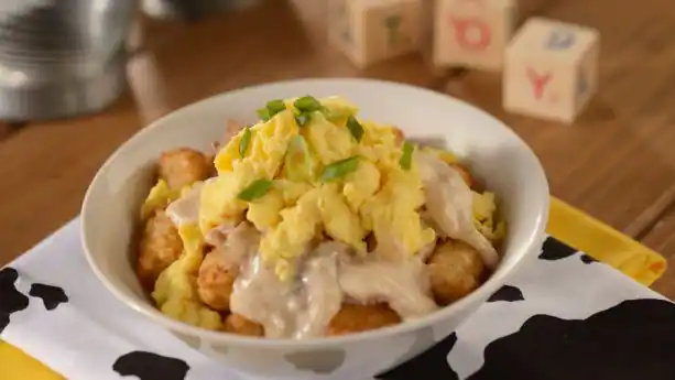 Breakfast bowl from Woody's Lunch Box in Hollywood Studios in Walt Disney World. Has scrambled eggs, potatoes, and biscuit gravy. 