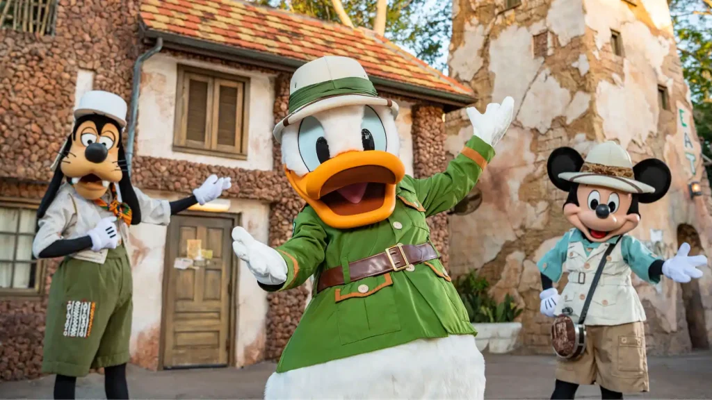 Goofy, Donald, and Mickey in Safari Outfits outside of Tusker House Restaurant.